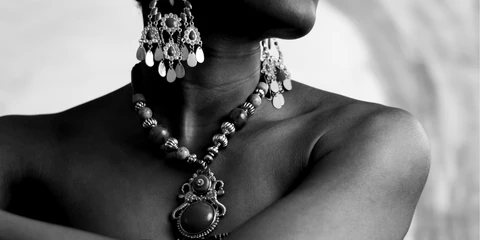 Woman Wearing Earrings and a Necklace Woman Wearing Earrings and a Necklace