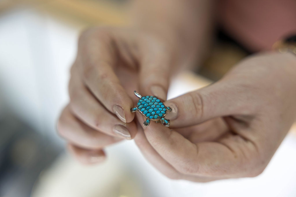 Antique brooches and rings on display