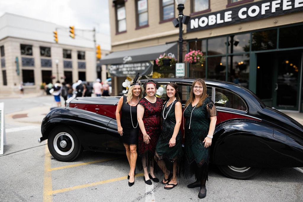 The Smith's team dressed up with a classic car